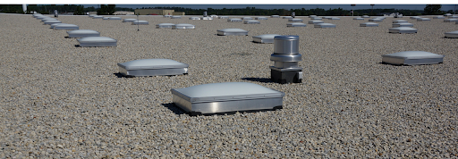 Ballasted EPDM rubber roofing installation in Katy Texas