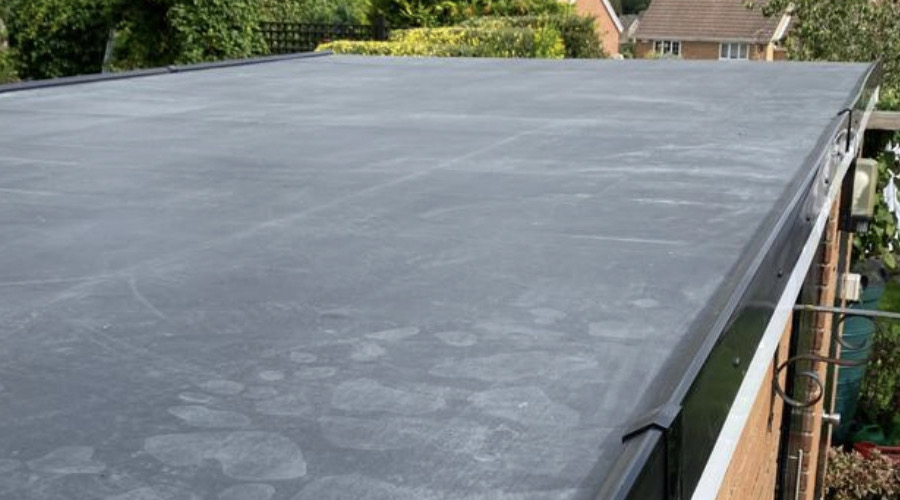Fully adhered EPDM rubber roof installed on home in Katy Texas