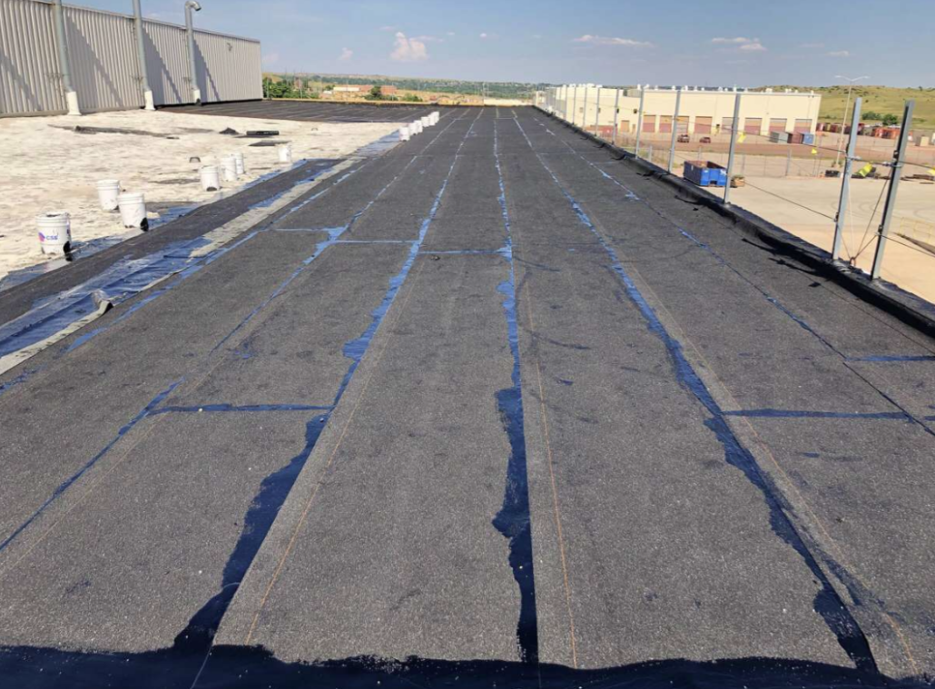 Built-Up Roofing (BUR) installation on a low-slope commercial building in Katy TX