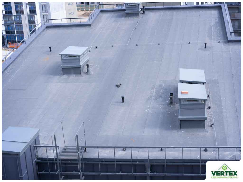 Low-slope roofing with stormwater drainage protection in Katy, TX during heavy rain