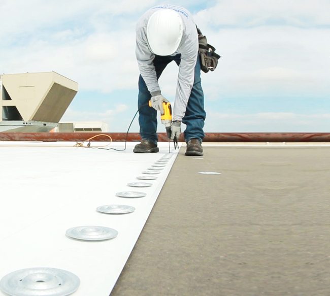 Mechanically attached PVC roofing installation in Katy TX commercial building