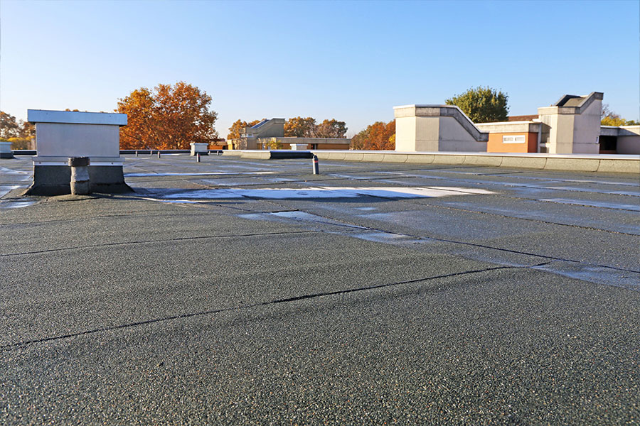 smooth roll roofing system on low slope roof in Katy Texas