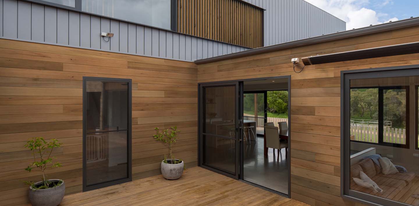 Cedar wood siding replacement on a traditional home in Katy, Texas