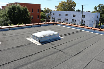 Modified bitumen roof installation on Katy TX commercial facility