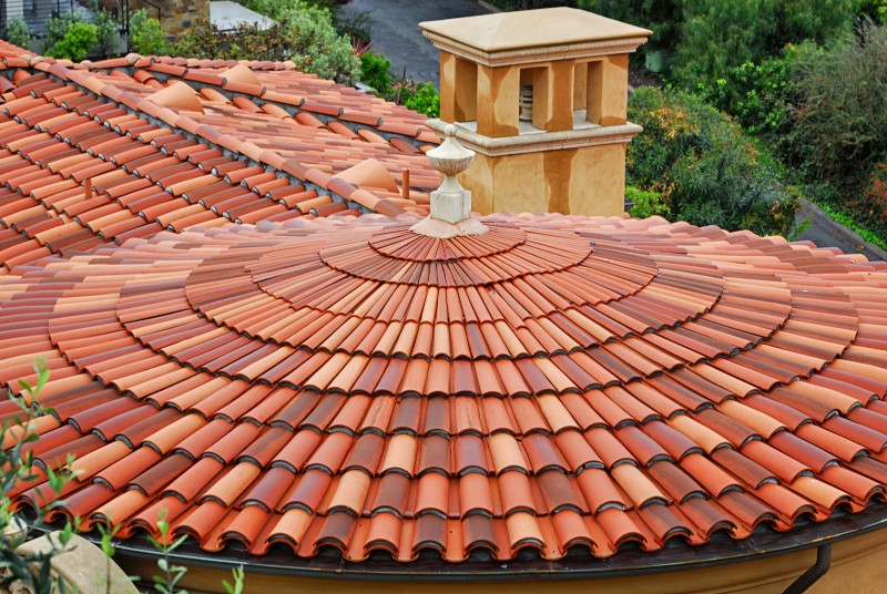 Spanish style tile roofing installed in Katy TX neighborhood